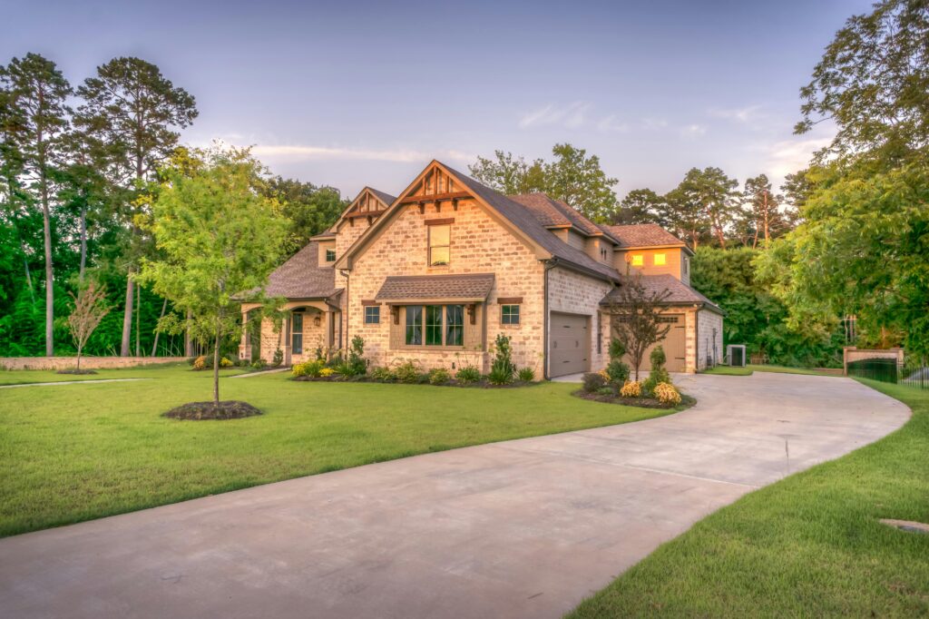 Custom craftsman-style home with landscaped front yard and driveway