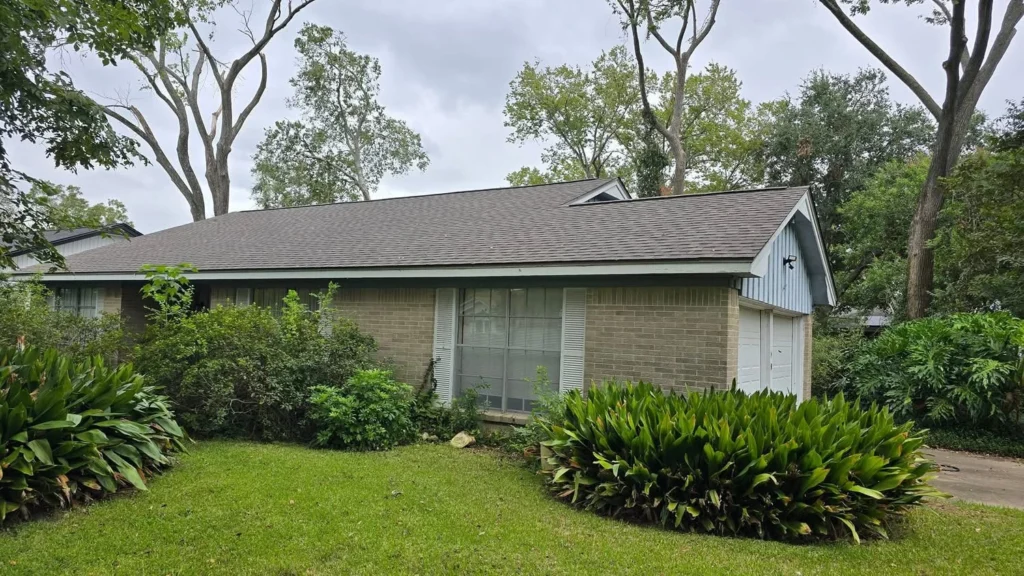 Finished roof with gray shingles on single-story home