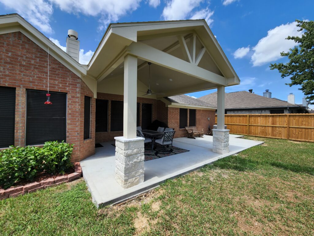 Front porch renovation with white gable truss design
